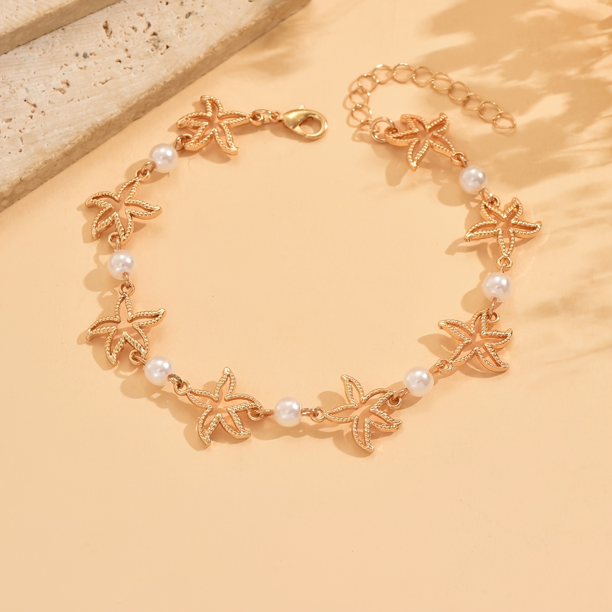E-shop 1 Stück Urlaubsinspirierte Fußkette mit goldenem, hohlem Seestern und künstlicher Perle, für bohemische Schmuckstücke im Strand-Stil für Frauen