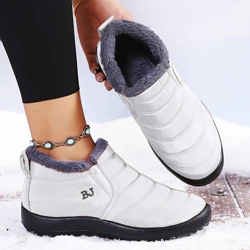 womens winter slip on boots with a thick fabric upper pu sole round toe flat heel and a stylish design cold weather in a solid color