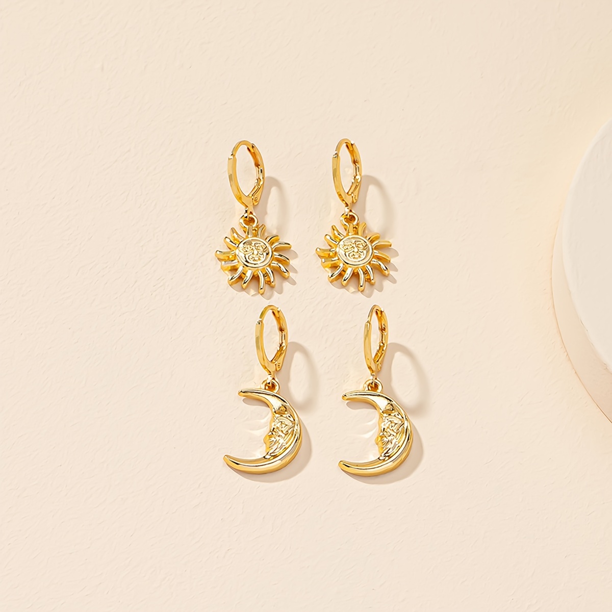 

European And American Popular Accessories: A Pair Of Sun Earrings And A Pair Of Moon Earrings, A Fashionable Earring Set With Design