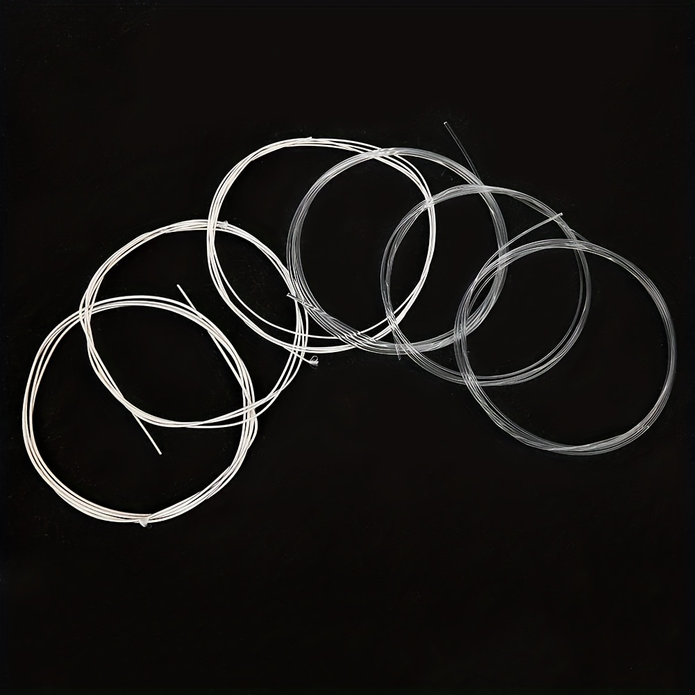 6pcs/Set (1-6 Strings, 1 Set of 6 Strings) High-End Nylon Strings for Classical Guitars, Featuring Nylon Plain Strings And Metal Wound Strings. The Transparent Nylon Strings Produce a Clear And Bright Tone. The Metal Wound Strings Have a Long Lifespan, Are Corrosion-Resistant And Anti-Oxidative, Providing a Comfortable Feel And Durability, Making Them Less Prone to Breakage.