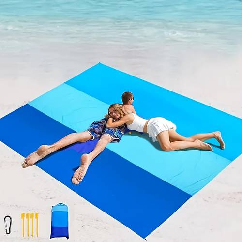 a sand proof beach mat that folded with four corner stakes suitable for outdoor camping travel vacation and hiking made of lightweight polyester material for picnics