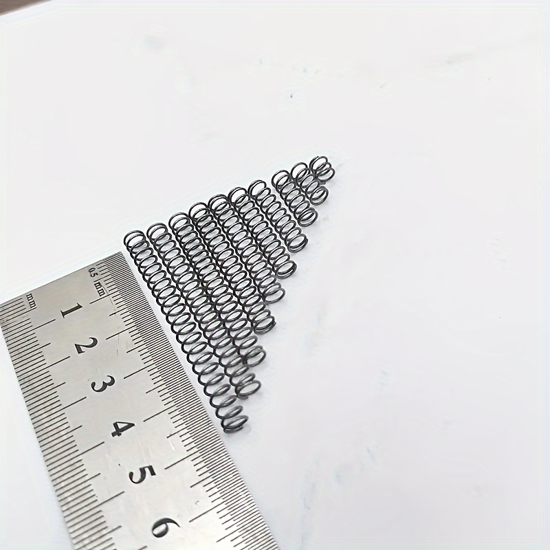 10 vnt. 0,6 mm skersmens suspaudimo spyruoklių, skersmuo 5 mm, ilgis 40 mm, tinkamos namų kasdieniniam priežiūrai, žaislų montavimui ir kasdieniniams priedų keitimams