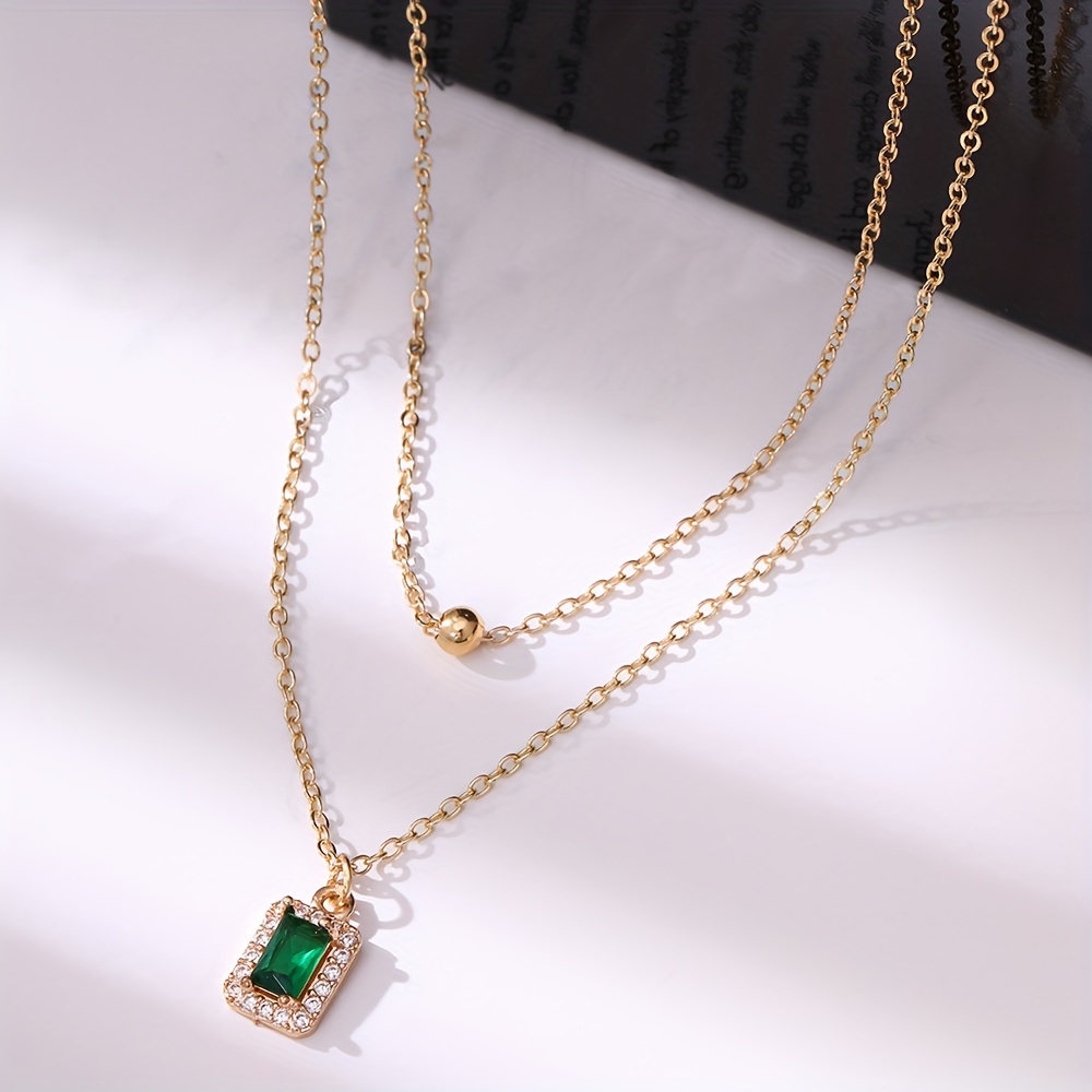 A Set of Two Stylish Classic Thanksgiving Necklaces Featuring Rectangular Pendants Inlaid with Zirconia Stones, Perfect for Layering, Along with Copper Bead Pendants, Making It an Ideal Gift for Women