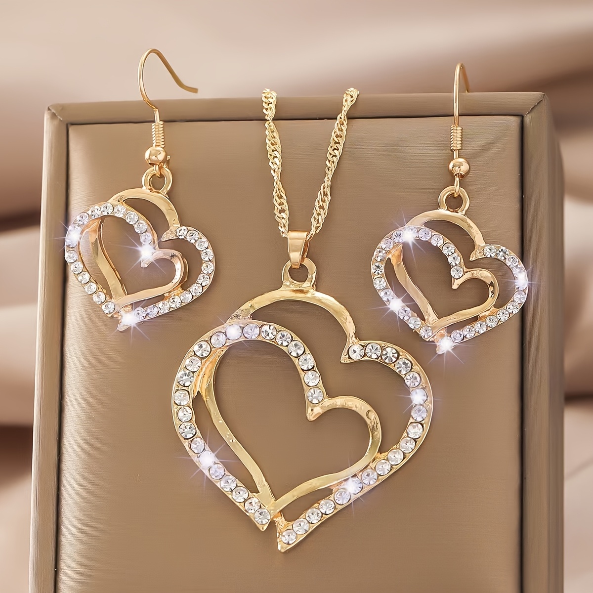 a creative and unique jewelry set consisting of 1 pair of earrings and 1 necklace featuring a sparkling heart shaped design with shiny rhinestones   accessorizing daily outfits or party wear details 2