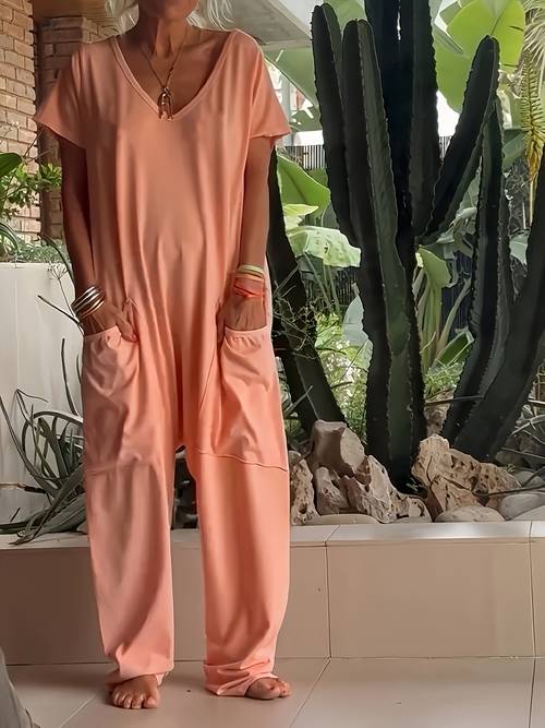 a womens loose fitting romper with pockets in a single color