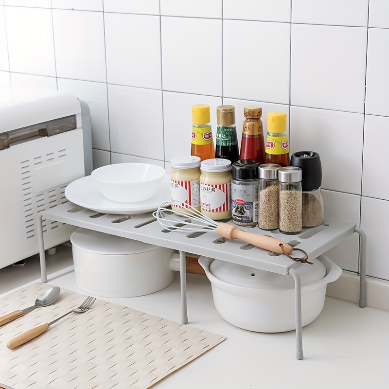 

Étagère en plastique de place, support de rangement polyvalent perçage pour cuisine, garde-robe, chambre d'étudiant et organisateur de pantoufles.