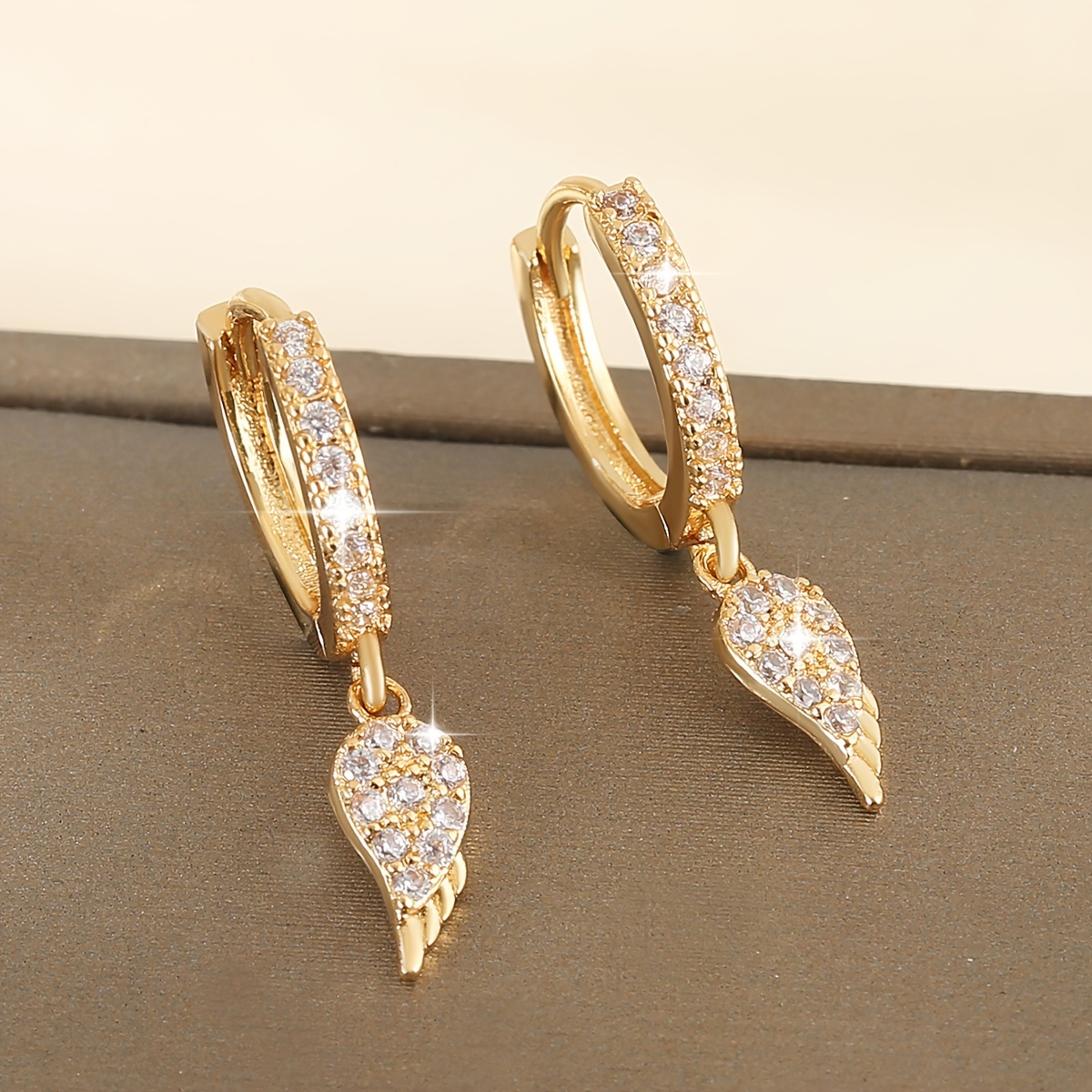 Image of Elegant Wings Dangle Earrings With Sparkling Cubic Zirconia - Luxurious Copper Design For Women, Perfect For Daily Wear & Gifting