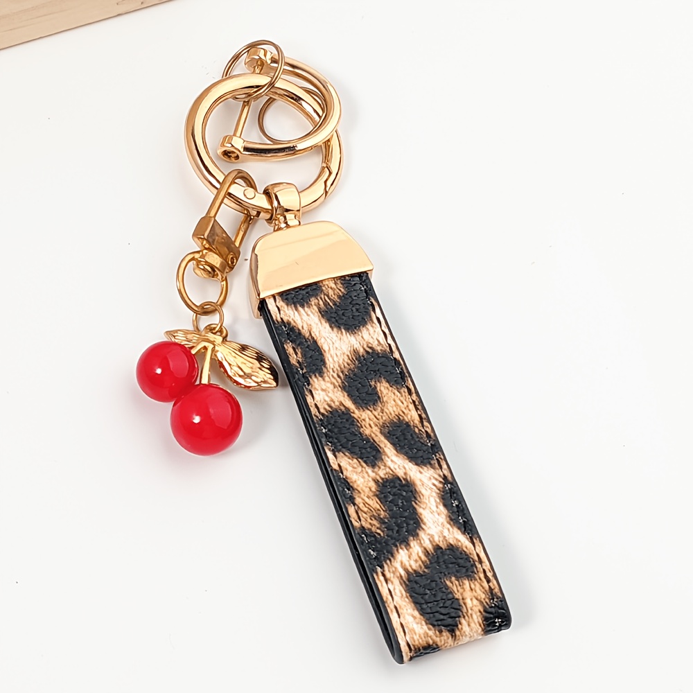 TEMU 1 Exquisite Leopard Print Leather Car Keychain With A Cute Cherry Pendant, Stylish And Versatile, A Perfect Accessory For Backpacks. A Perfect
