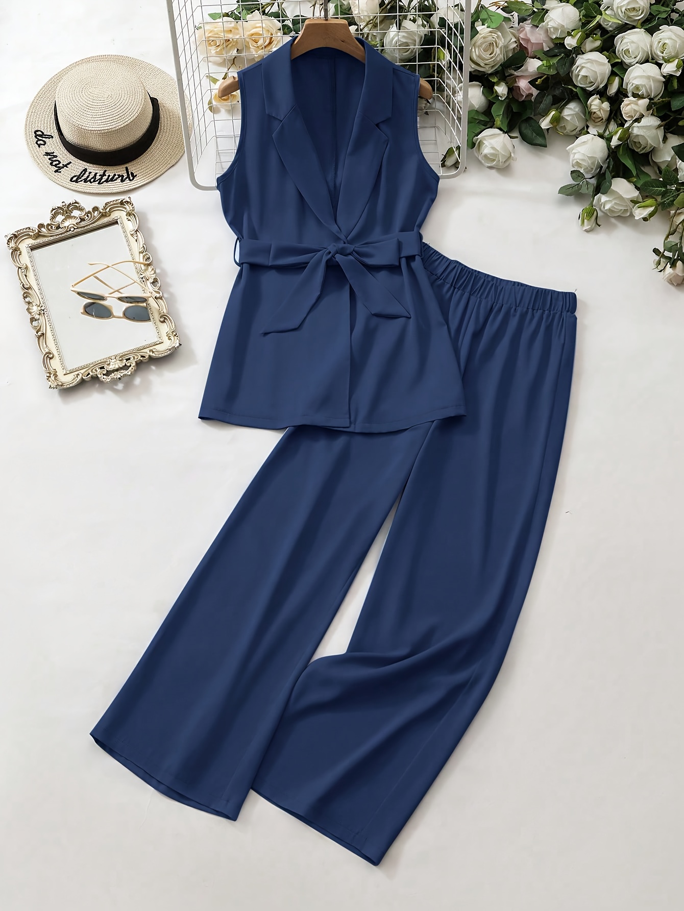 Effortless Chic Navy Blue Pantsuit by Newness A sophisticated navy blue pantsuit perfect for any occasion