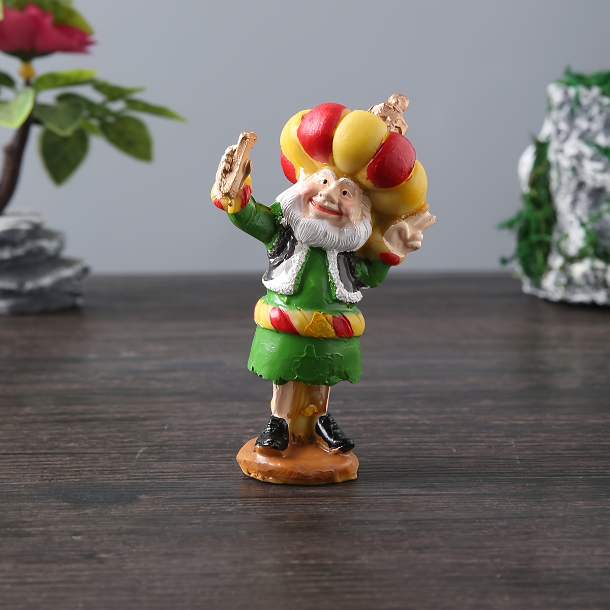 a resin figure of a chubby old man with a cannon suitable for decoration during eid celebrations Product details 8