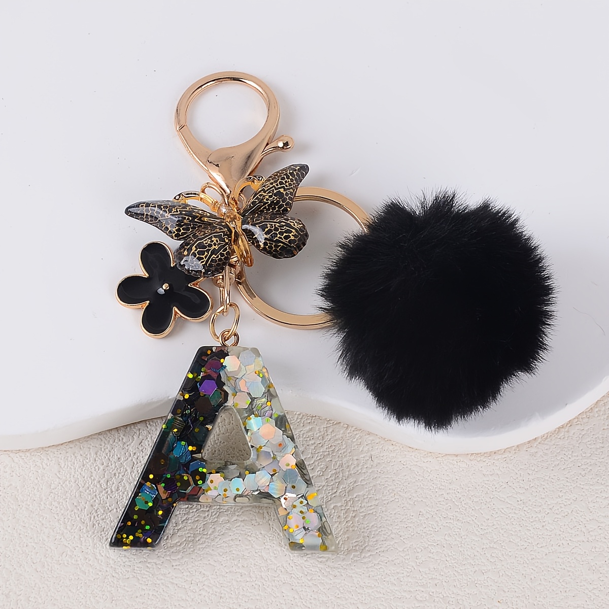 TEMU 1pc Women's Fashion Initial Keychain Black Floral Pom Pom Resin Letter Key Chain Women's Holiday Gift Backpack Pendant