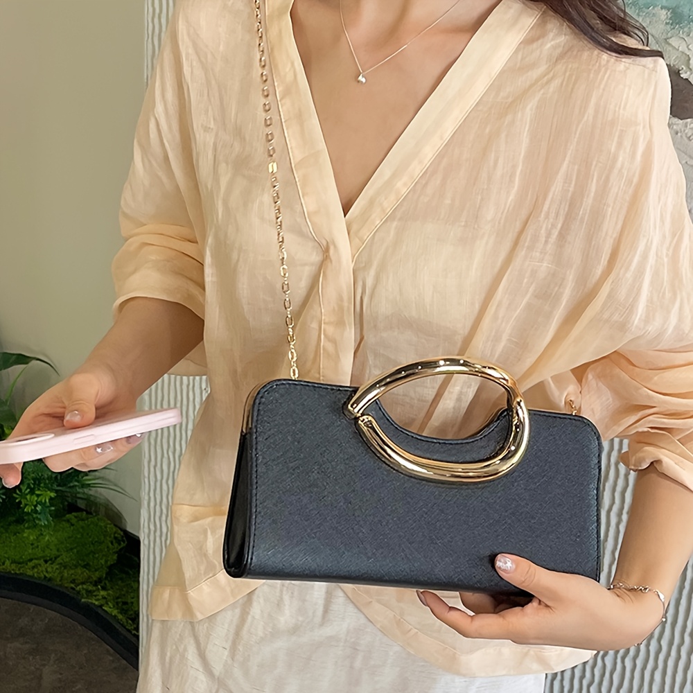 Elegant Metallic Handbag with Oval Metal Handle and Chain Strap