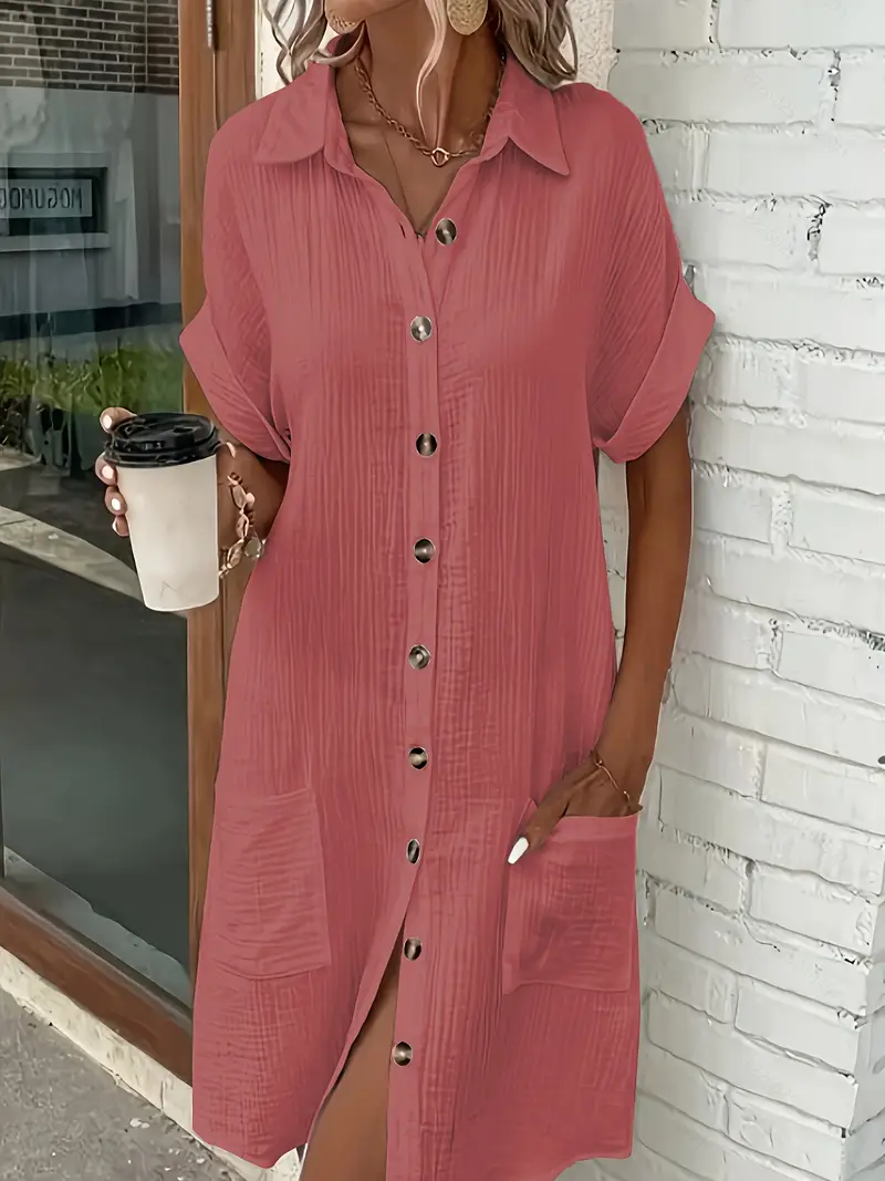 a minimalist white shirt dress made of breathable featuring a sharp collar design and buttons that add a touch of details 4