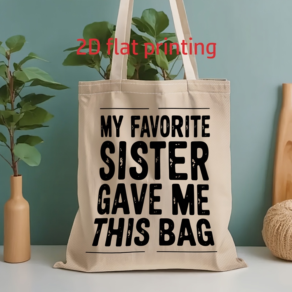 Image of 1pc Men's & Women's Large Capacity Tote Bag Suitable For School, Work, Vacation - Unisex Shoulder Bag With " Sister Gave Me This Bag" Print, Handbag For School, Work, Travel Gift For And, 2d Flat
