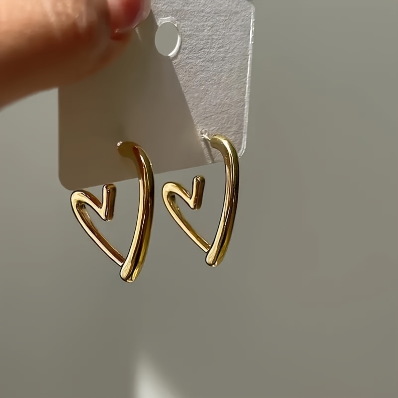 1 pair elegant 18k golden plated hollow heart shaped hoop earrings for women cute 304 stainless steel hypoallergenic non fading versatile for daily wear christmas gift Product details 1