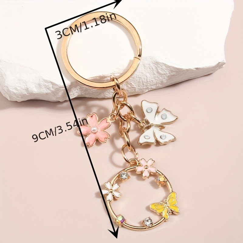 Gold Key Bracelet w/ Flower & Butterfly Charms