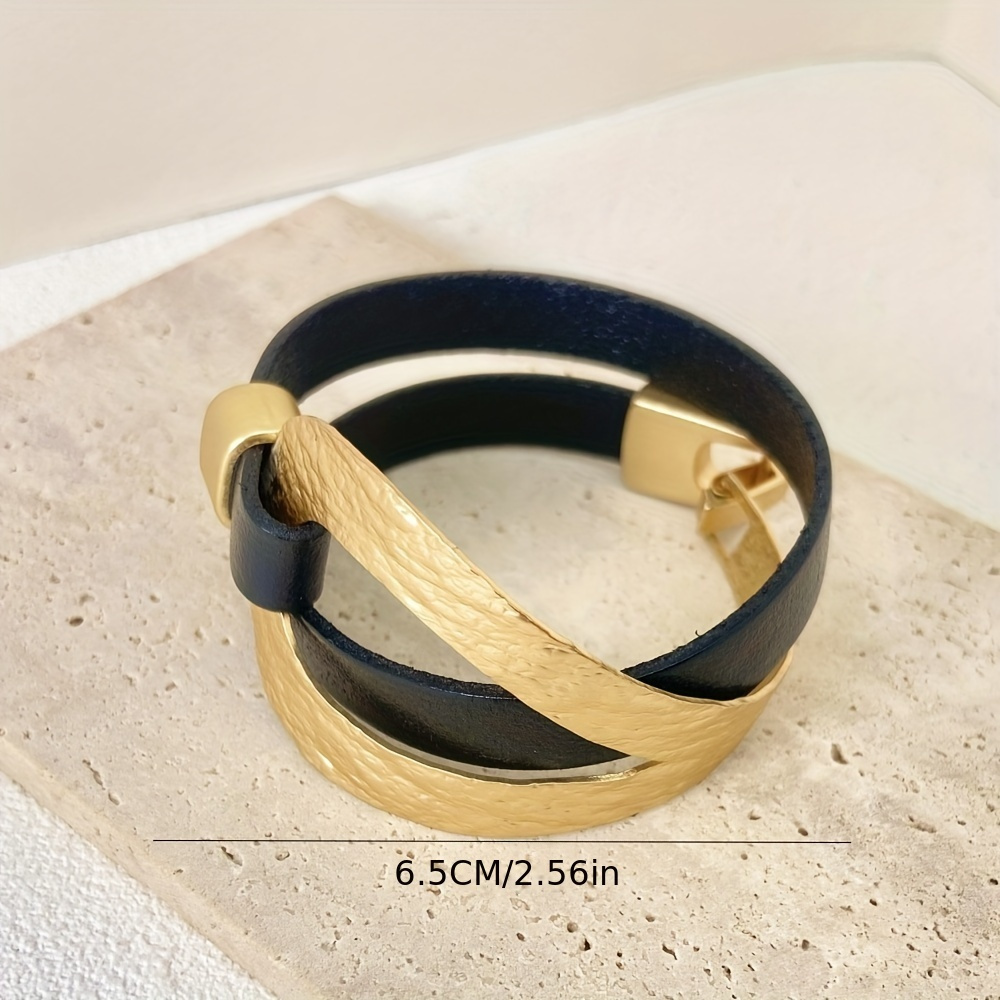 Image of A Metal Bracelet With Black Cord And Golden Bangle, A Trendy Bracelet For Party Gifts