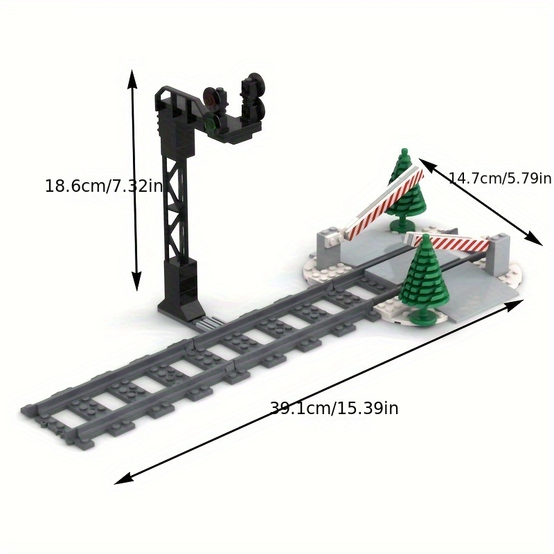 Piste de train urbain avec feu de circulation, panneaux de signalisation,  indicateur de signalisation routière en brique, barrière de signalisation,  modèle de construction, jouets de nuit