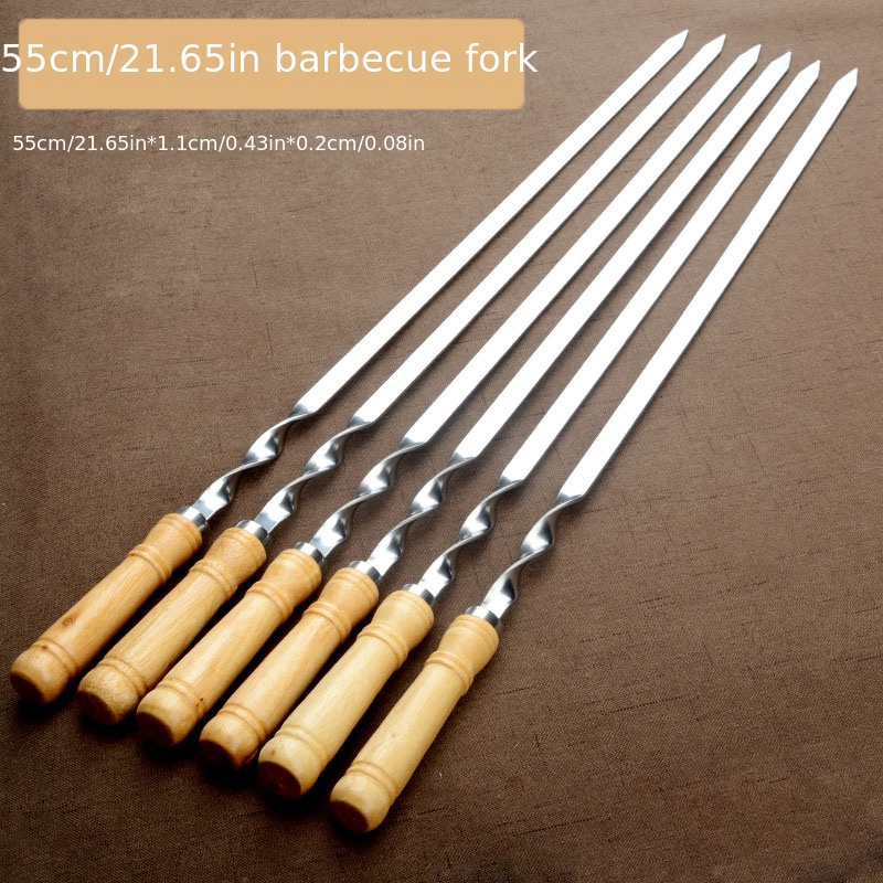 

Set of 6 BBQ skewers with 55cm long handles, ideal for grilling shish kebabs. Made of wood and stainless steel, perfect for outdoor barbecues, picnics, and camping.