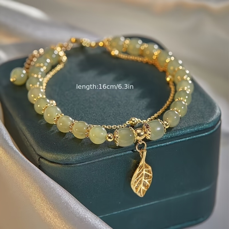 Golden Tone Leaf Charm Bracelet with Green Beads