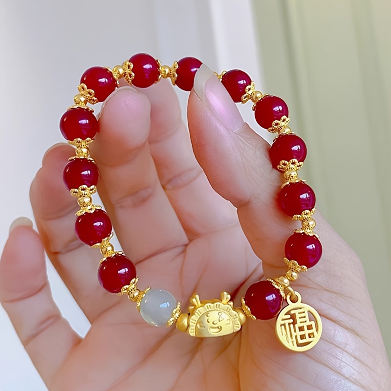 Red bracelet lucky hot sale charm meaning