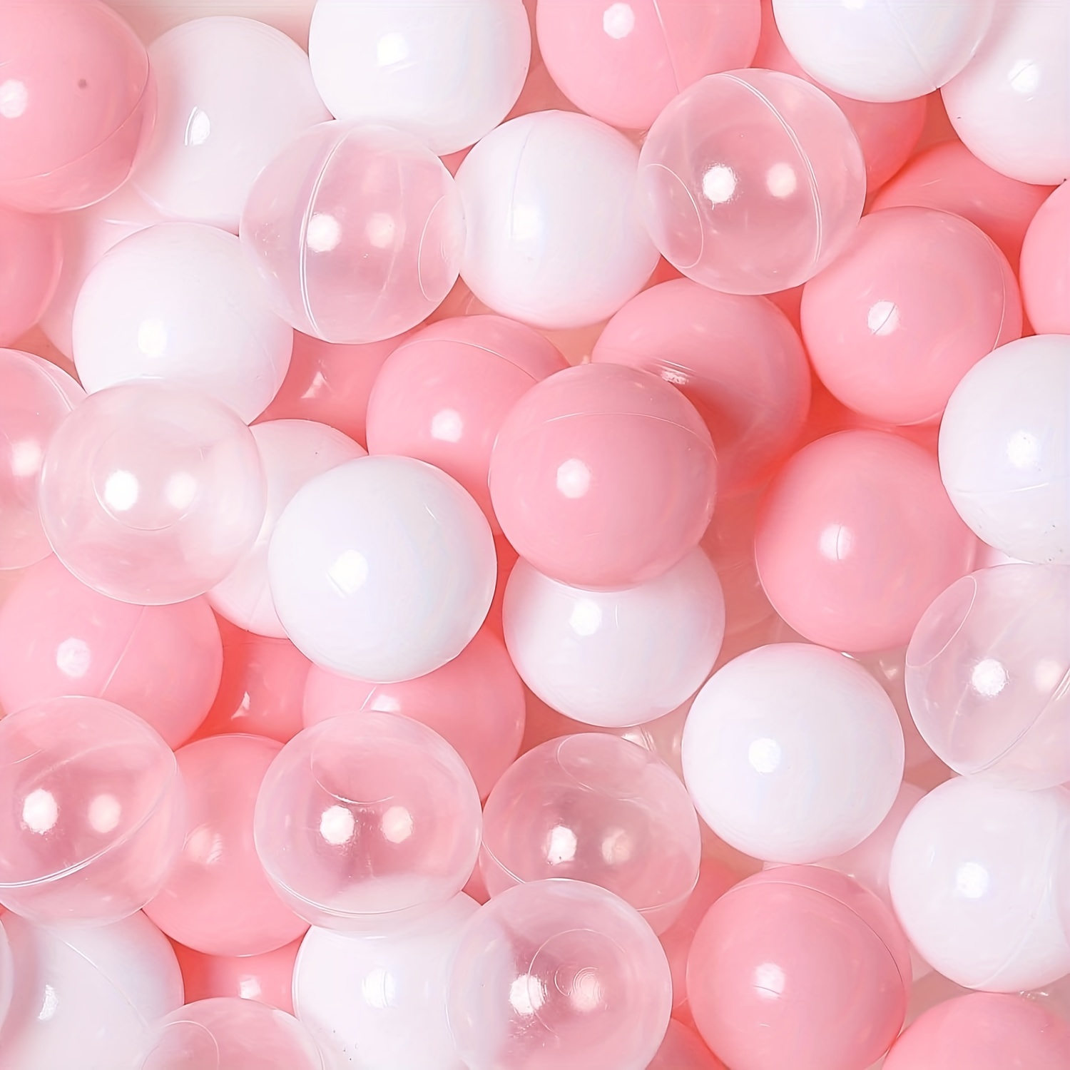 Piscina de bolas rosa, gris y blancas