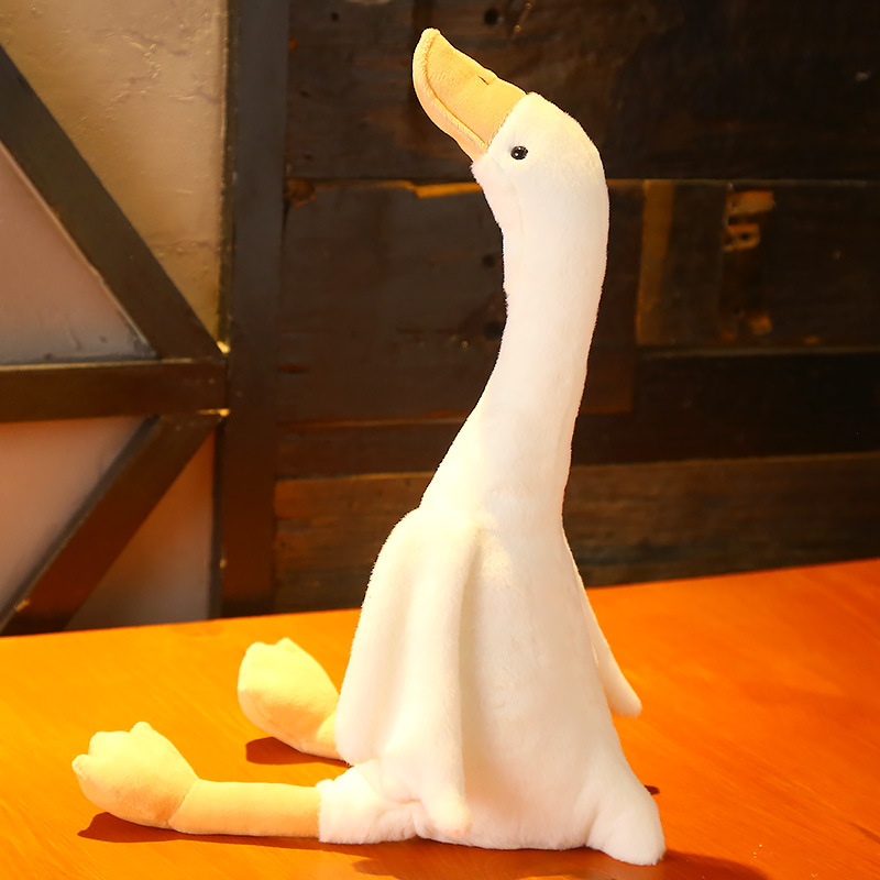 adorable plush toy of a long necked goose   cuddling a great gift for birthdays and a   addition to room decor