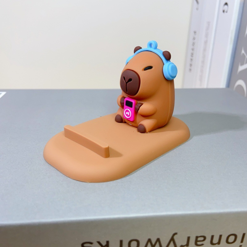 E-shop Niedlicher Capybara Handyhalter - Fauler Schreibtischorganizer mit Ausdrucksstarken Augen, Rutschfeste Basis, Kompatibel mit Smartphones &