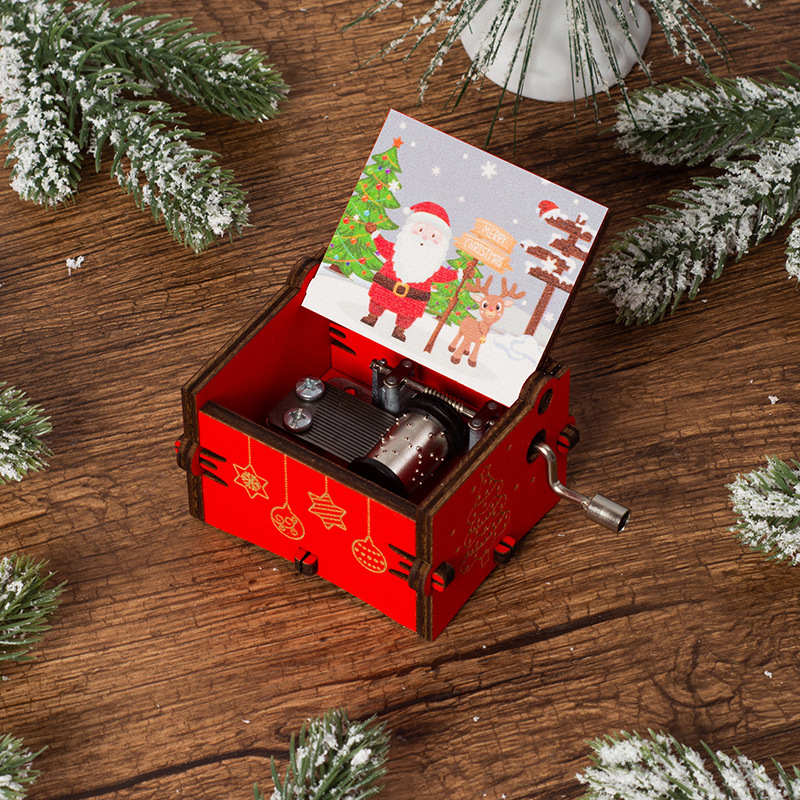 Image of A Red Wooden Music Box With A Christmas Theme, Featuring Cards With And Christmas Designs Inside . Turning The Crank Plays Music, Making It A Great Decoration For The And An Ideal Gift