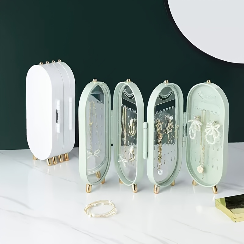 a foldable jewelry storage box with a   featuring a large capacity earring and necklace holder with   designed as an attractive display case for dressing tables it   a foldable earring clip jewelry organizer Product details 4