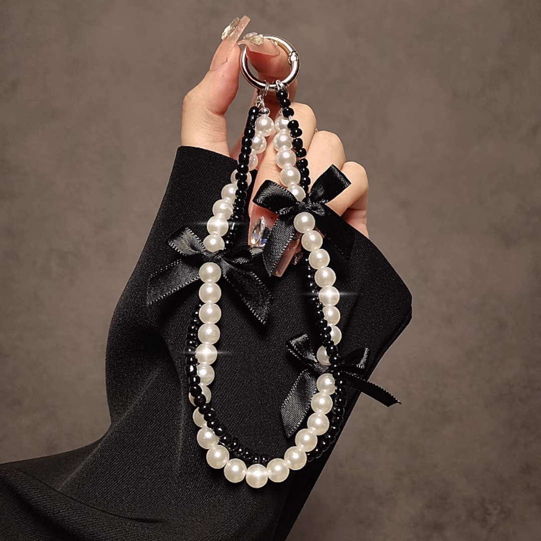 Image of A And Artistic Black Pearl Hand Chain, Featuring A Short Wrist Strap With A Clip, Suitable For Phone Cases, Keychains, And Bag Charms
