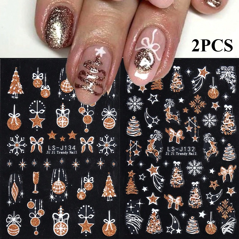 Image of Set Of 2 Golden Christmas-themed Nail Stickers Featuring Glittery Snowflakes, Deer, Stars, Bows, Christmas Trees, Bells, And Wine Glasses, Perfect For Nail Art And Salons