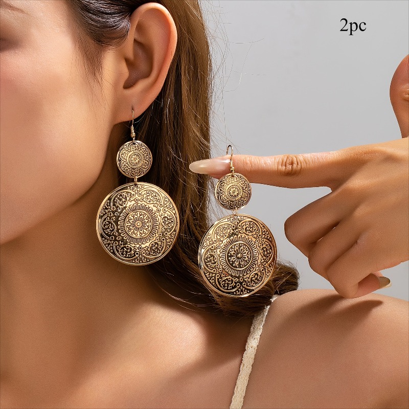 Image of 2pcs Bohemian Vintage Carved Round Disc Earrings, Niche Design Dual-color Ethnic Style Dangle Earrings, Suitable For Daily Wear And Parties
