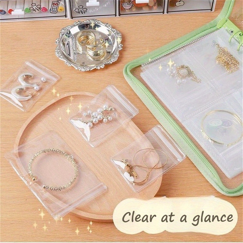 1set high capacity travel jewelry storage box contains   book fifty small bags and   large bags a   of colors   from transparent multi grid storage suitable for earrings necklaces rings portable storage bag     jewelry roll for   suitable for birthdays valentines day thanksgiving   and other holiday gifts jewelry boxes and storage jewelry storage roll jewelry rolls Product details 1