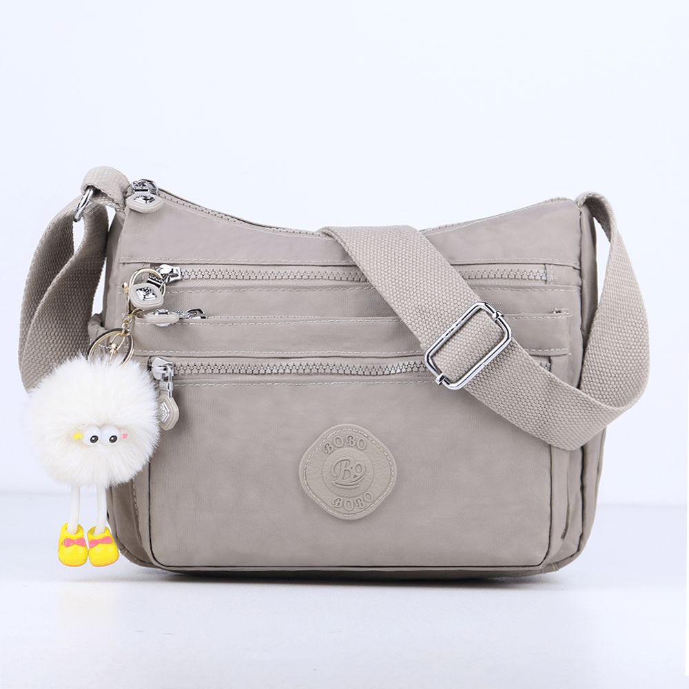 stylish lightweight multi pocket unisex crossbody bag with pendant elegant durable womens shoulder bag sturdy anti theft womens crossbody bag durable fabric multiple compartments adjustable straps perfect for travel daily use commuting Product details 13
