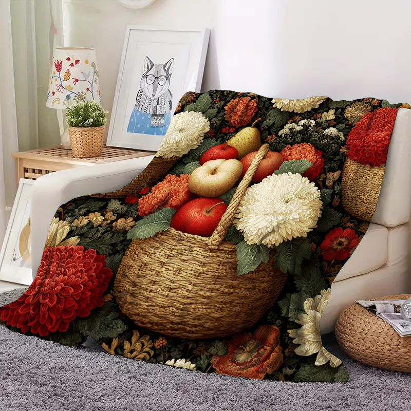 eine gemusterte decke korb früchten blumen gefüllt