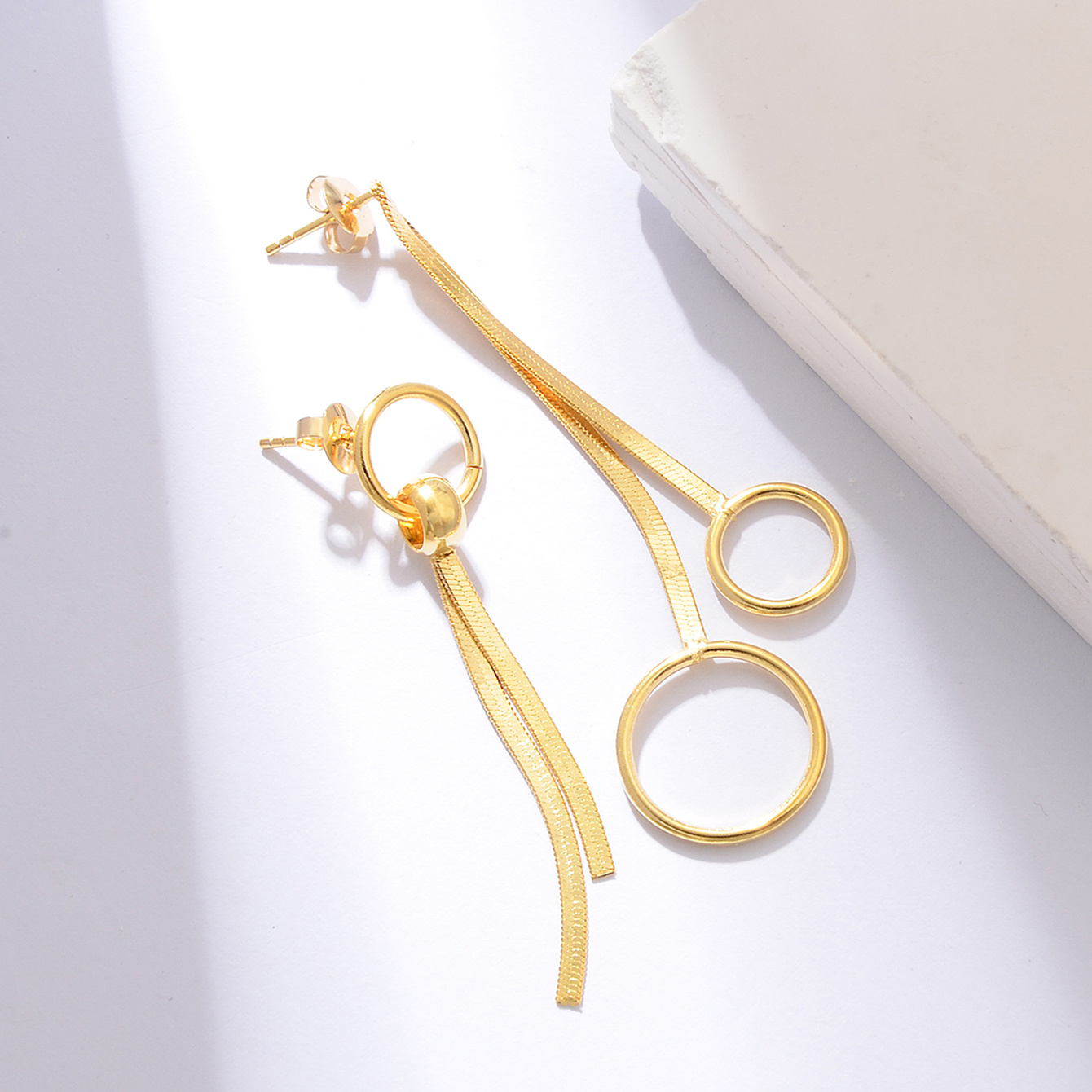 Women's Asymmetrical Circular Ring Snake Bone Chain Tassel Earrings