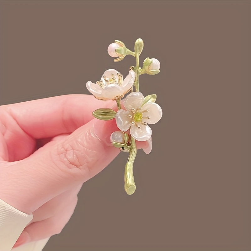   style jasmine flower brooch is suitable for women featuring   of     designed for suit   with a non slip pin making it a fashionable accessory that pairs well with dresses and jackets