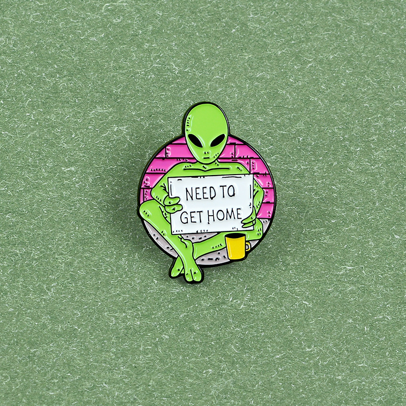 Green Alien Reading Newspaper Brooch