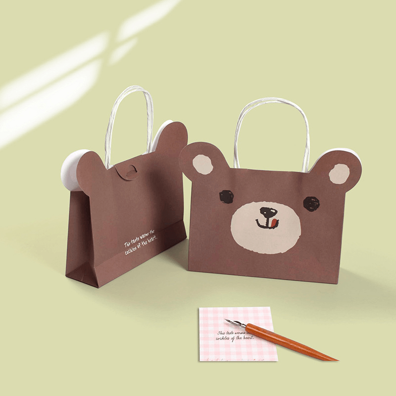 A Set of Gift Paper Craft Bags with Drawings of Animals. Stock