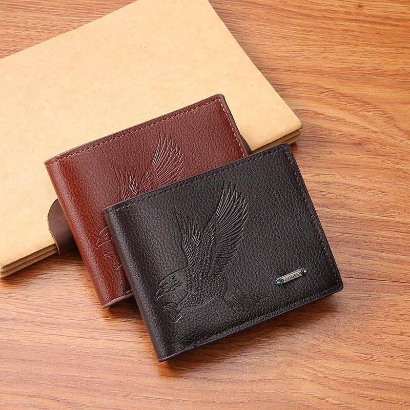 Leather coin-pocket wallet with all-over embossed eagle