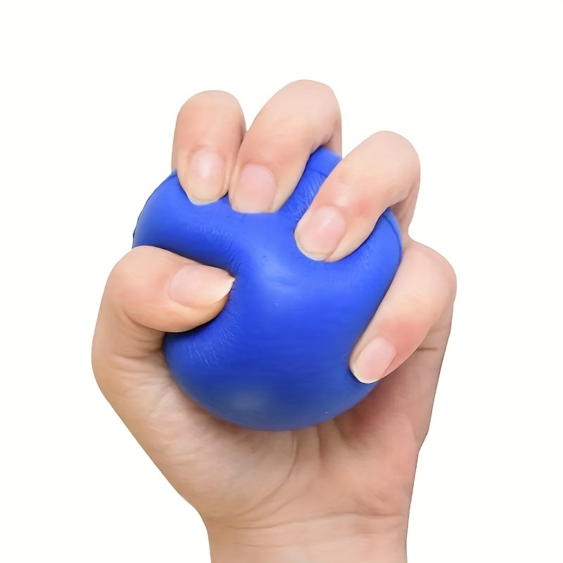 The Hand is Holding Heart Shaped Squeeze Ball for Hand Muscle