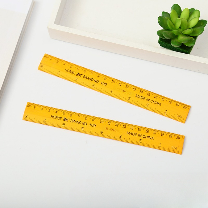What a long ruler. Surprised little student holding rigid wooden ruler on  yellow background. Small child taking measurements with metric ruler. My  ruler is one meter long Stock Photo by ©stetsik 357046252