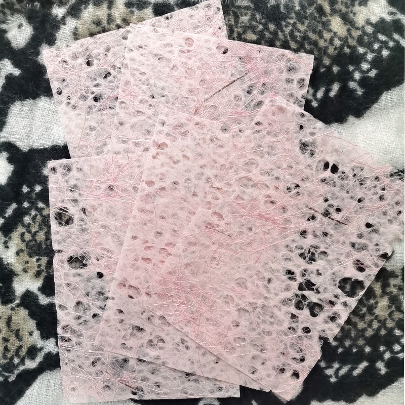 Textured paper with specs, white & light pink