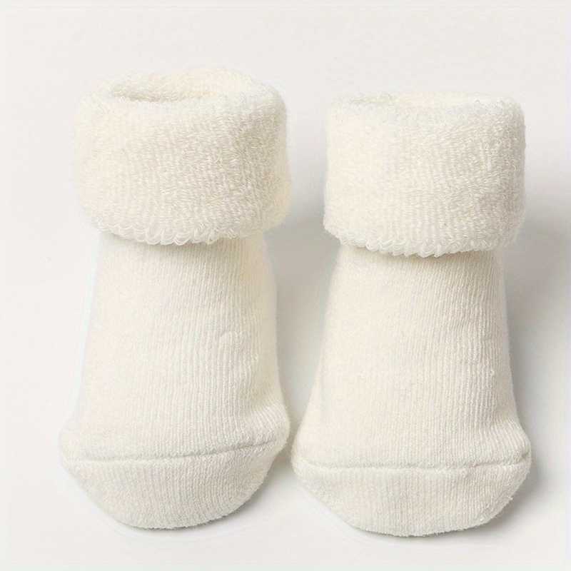 Image of Solid Color Warm Newborn Socks With Anti-slip Bottom Glue Baby Socks Thickened Warm Floor Socks Baby Mid-tube Terry Socks Anti-slip And Non-strangling Feet