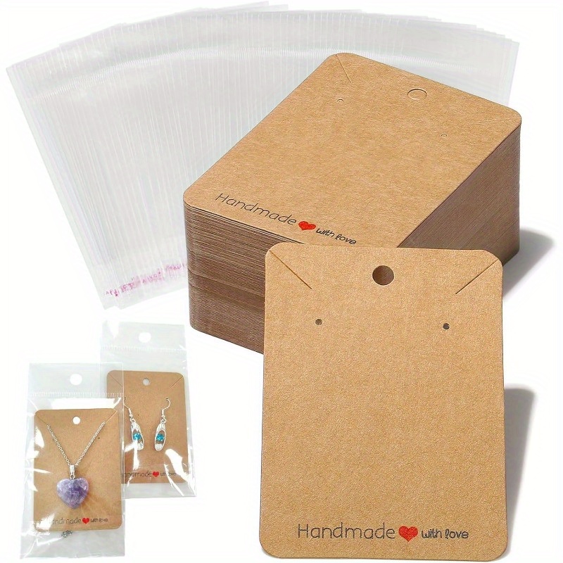 

50pcs Earring Display Cards - Brown Jewelry Holders With Perforation & Slots, Includes Stylish Transparent Packaging Bags For Small Businesses