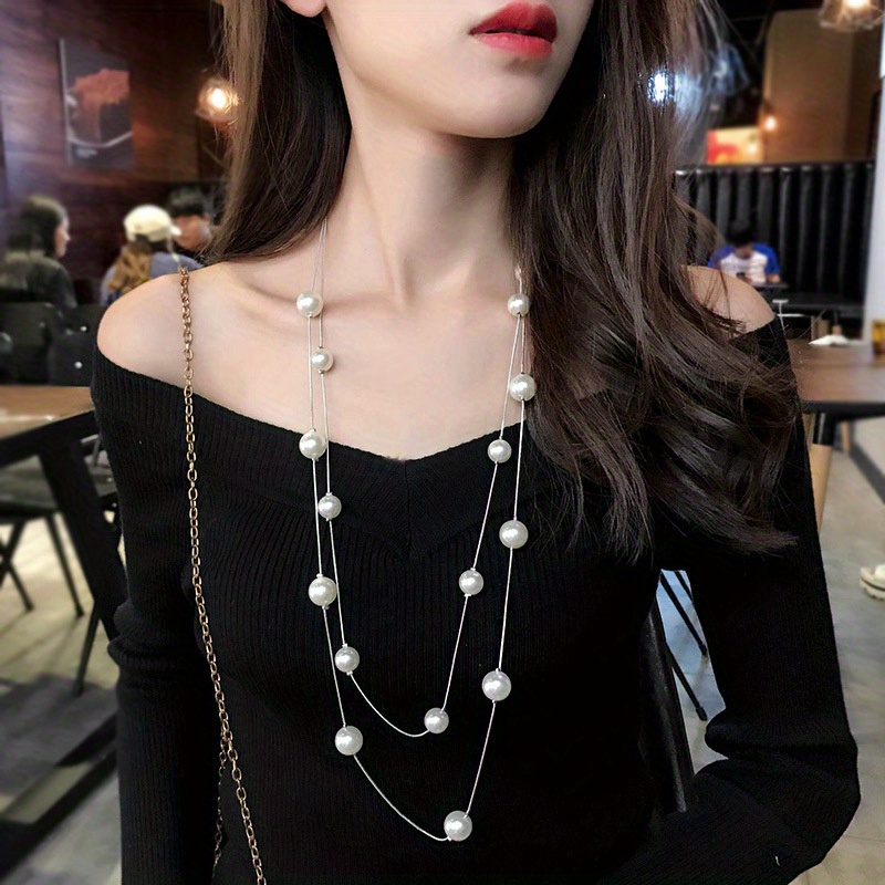 Long, multi-layer pearl sold sweater chain