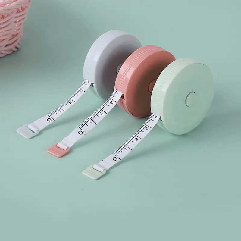 Premium Photo  Blue and pink plastic measure tape with metric scale over  on color pink background