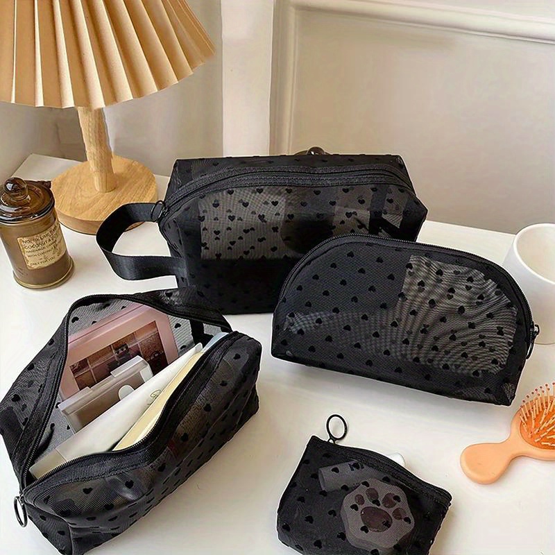 

A Portable Toiletry Organizer Featuring A Four-piece Love-themed Mesh Makeup Bag, Designed For Women To Store Lipsticks And Other Cosmetics.