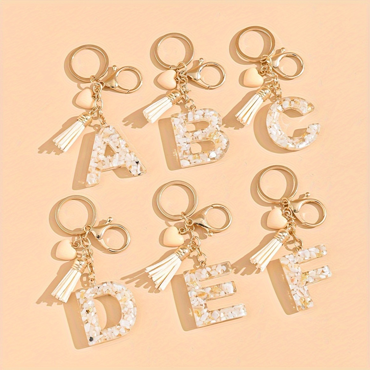

Resin Alphabet Keyring With Heart & Tassel Charm, Lobster Clasp Closure, Valentine's Day Gift, Single Piece Decorative Ladies Keychain With Love Theme - Ideal For Friends.
